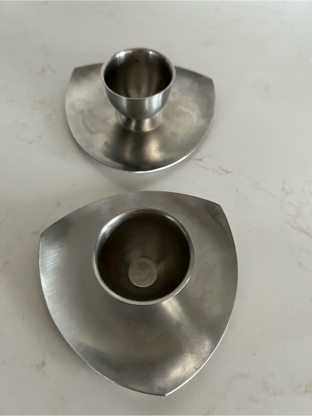 Vintage brushed stainless steel modernist egg cups from the 1970s or 1980s.